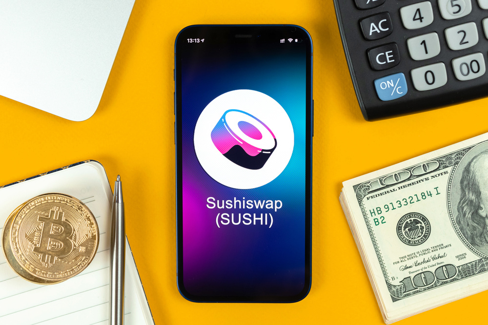 Sushiswap coin symbol. Trade with cryptocurrency, digital and virtual money, banking with mobile phone concept. Business workspace, table with laptop top view photo